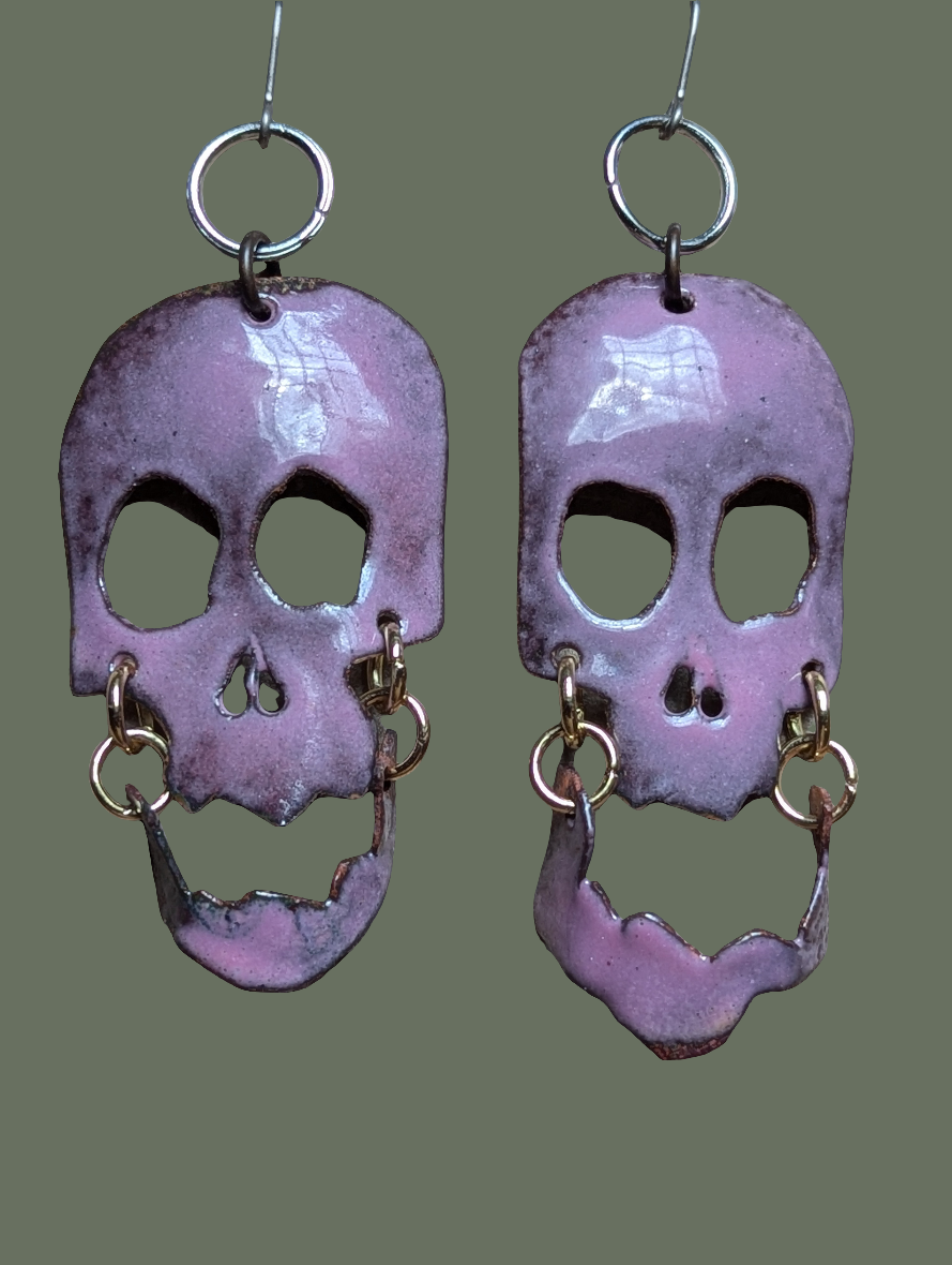 Skully earrings with halo and flair for days. Enameled hand formed copper with moving jaws