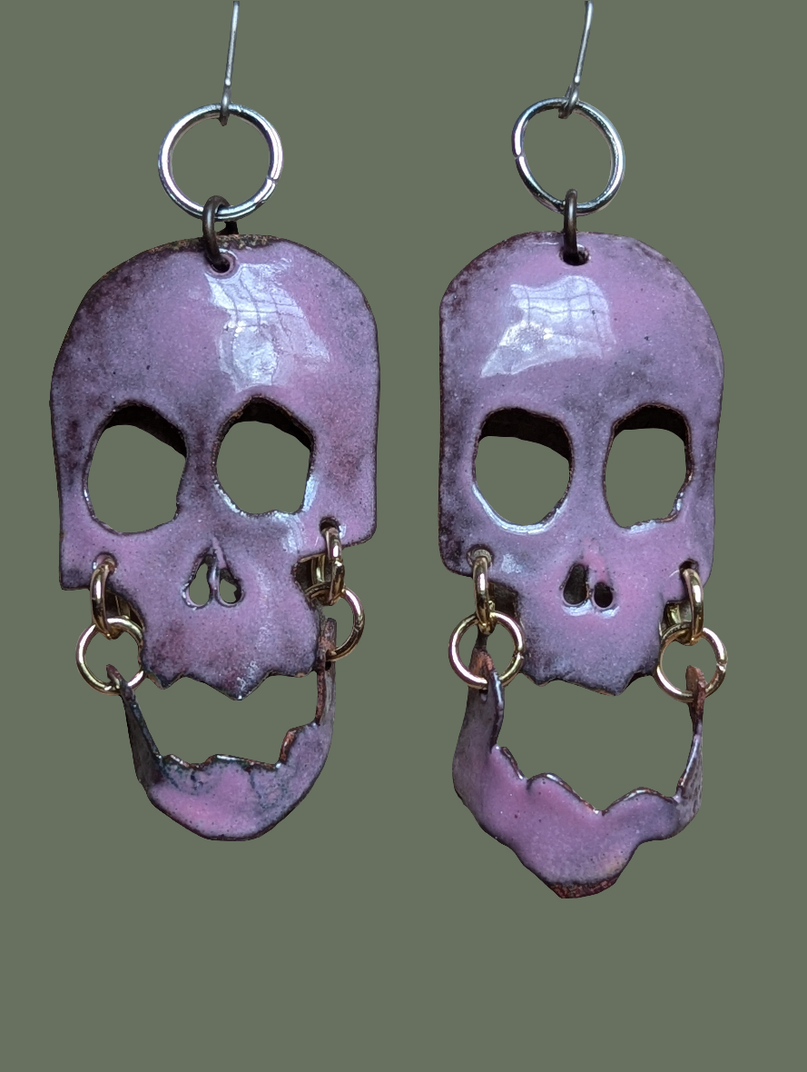 Skully earrings with halo and flair for days.  Enameled hand formed copper with moving jaws