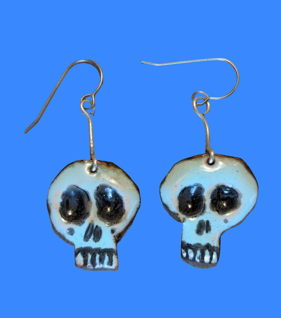 Super cute Skully earrings.  Enameled copper with sterling silver accent wire.