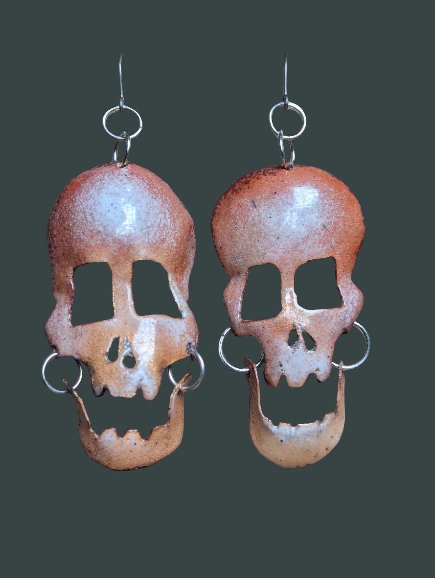 Skully earrings in translucent enamel letting the brushed copper shine through.