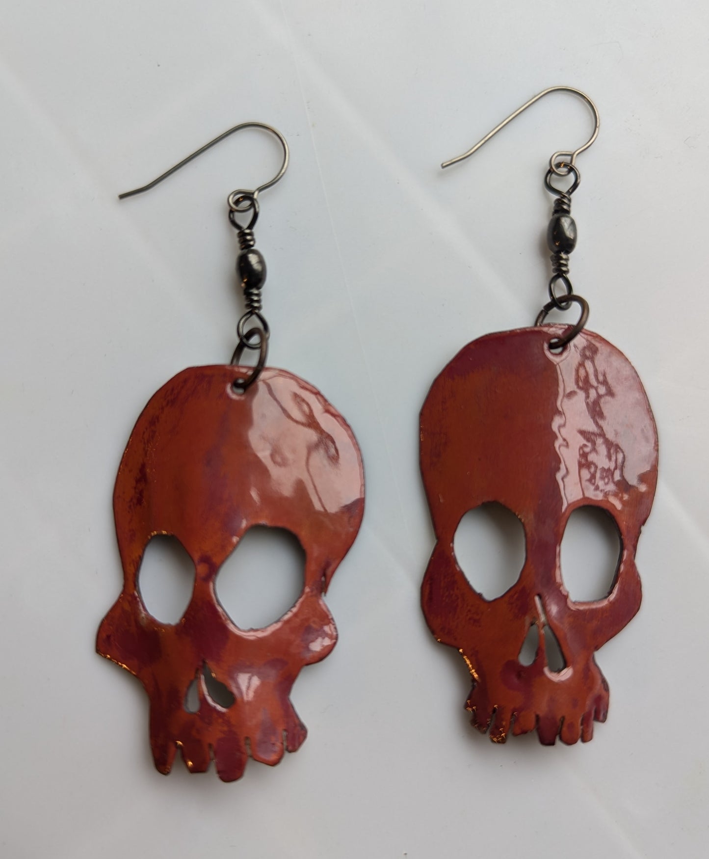 Skull earrings: handmade, rotating, torch fired enamel, one of a kind