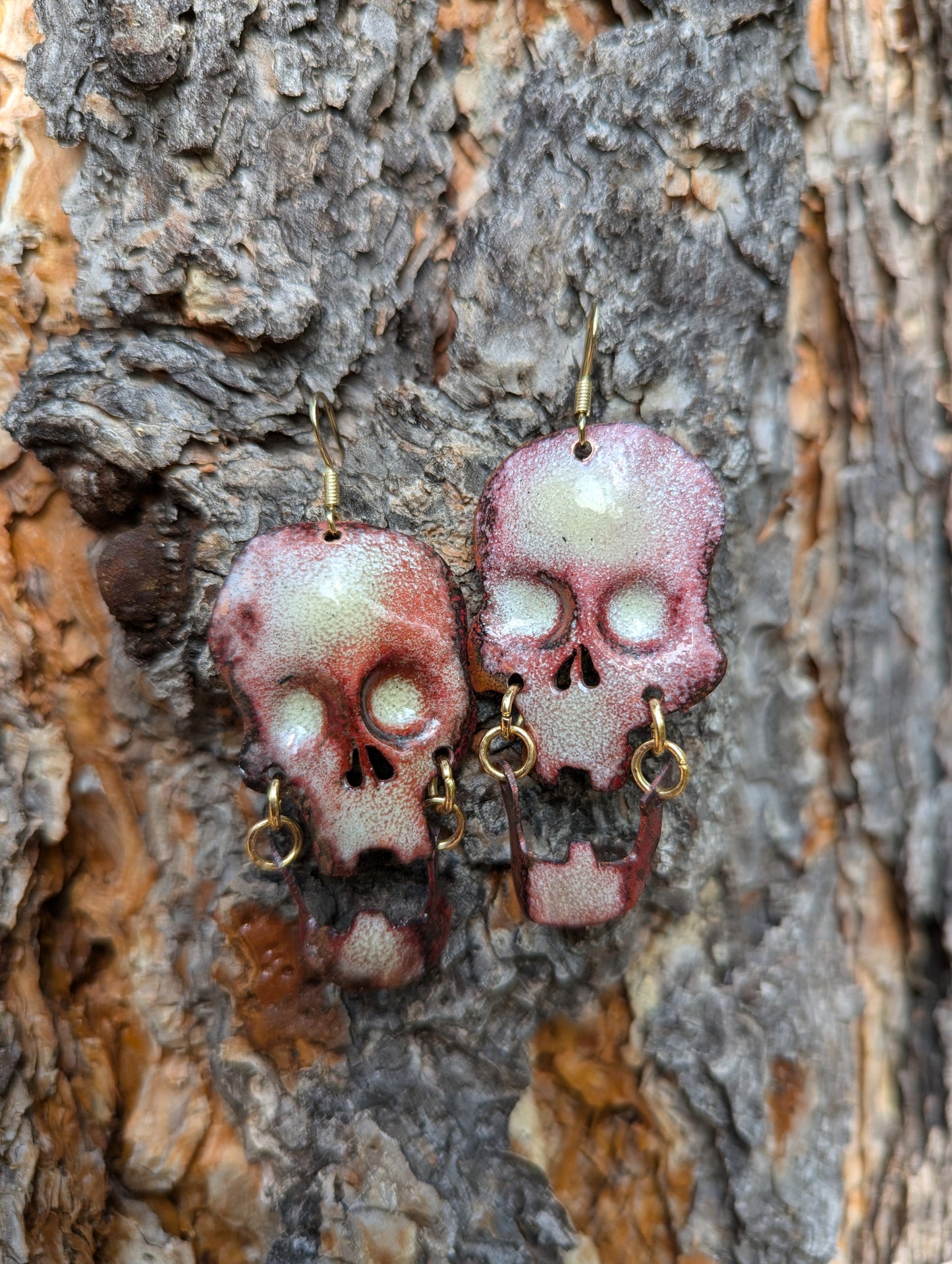 Skull earrings: handmade, torch fired enamel, swinging jaws