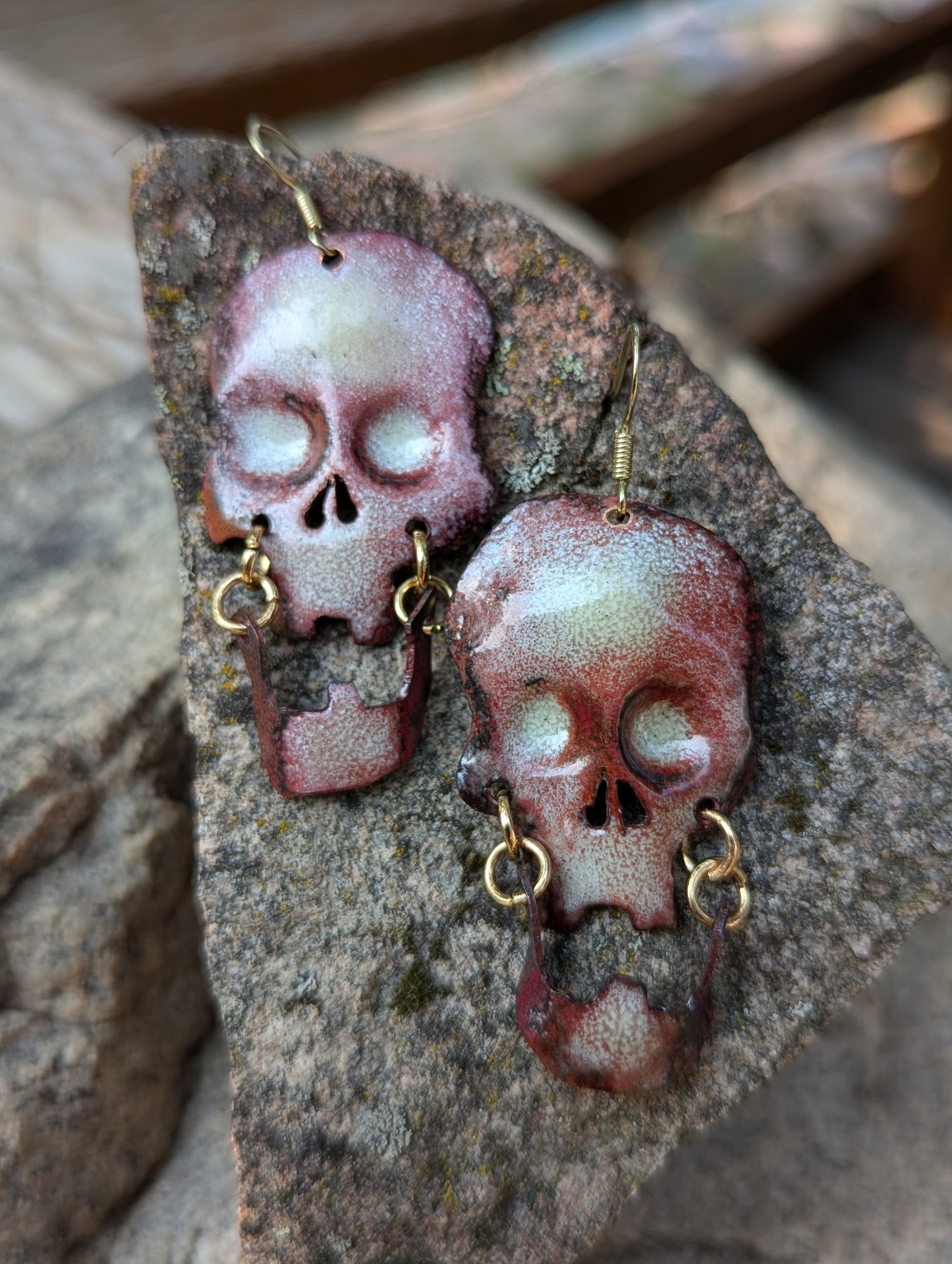 Skull earrings: handmade, torch fired enamel, swinging jaws