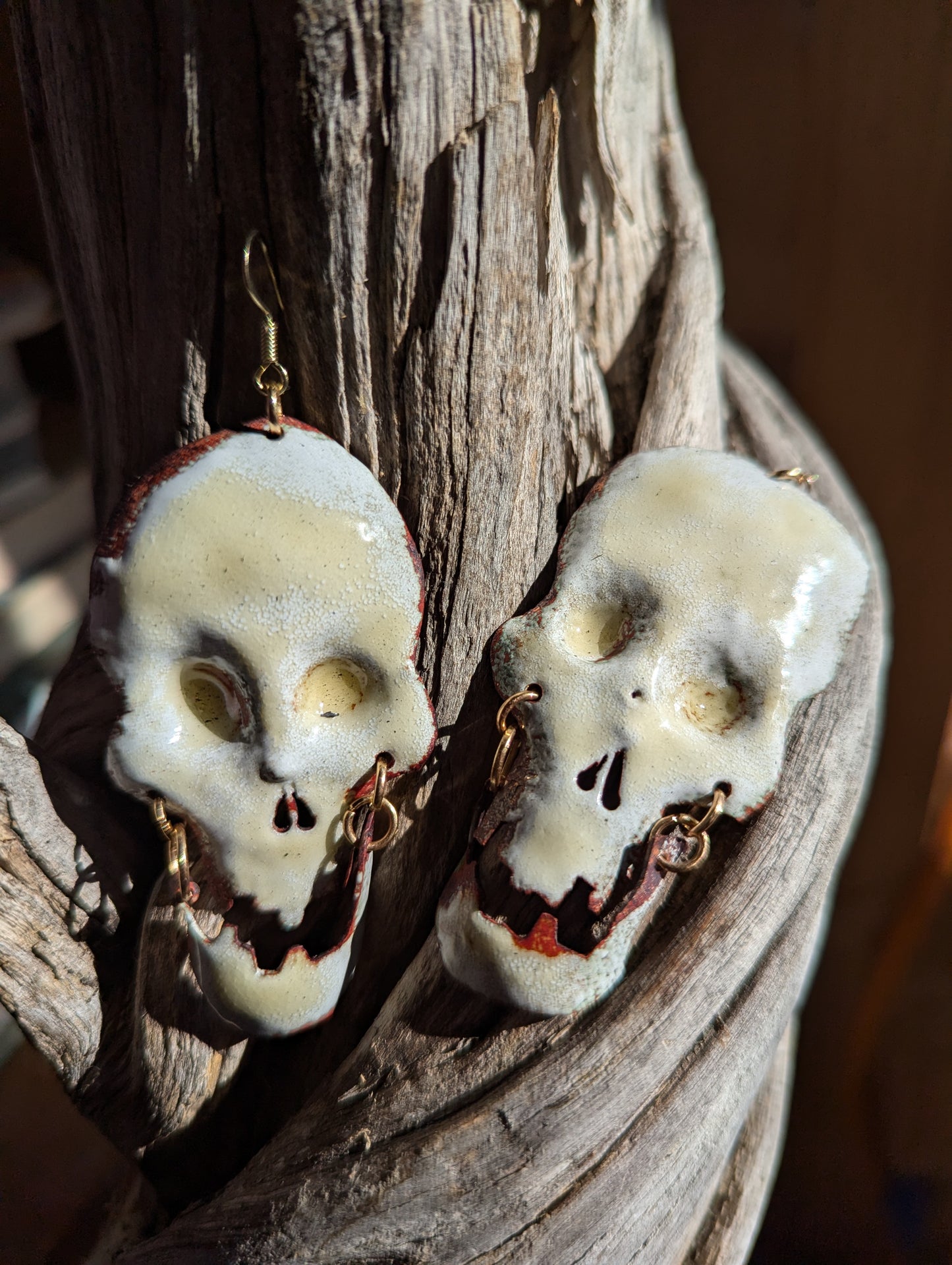 Big skull earrings: handmade, torch fired enamel, swinging jaws