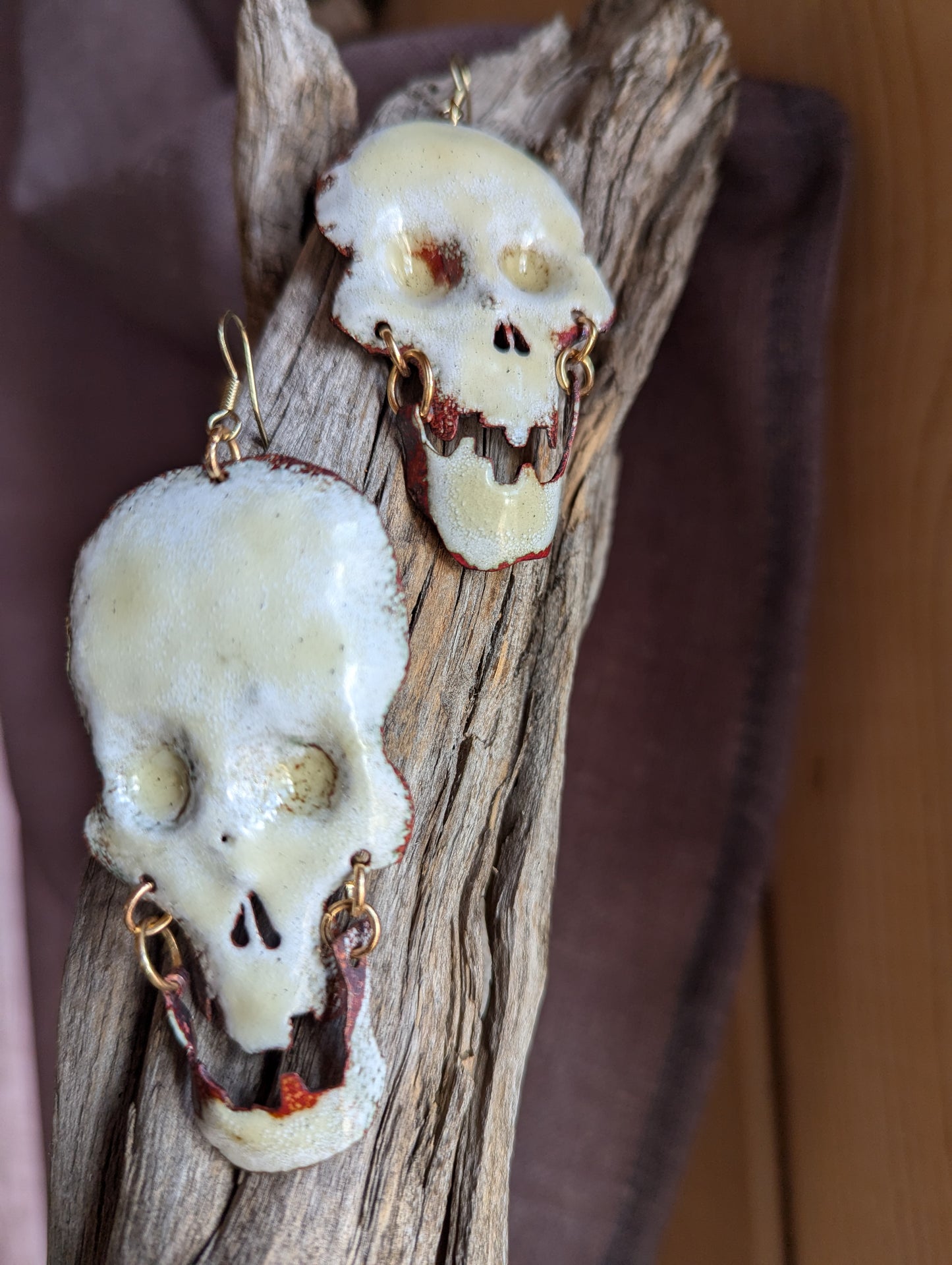 Big skull earrings: handmade, torch fired enamel, swinging jaws