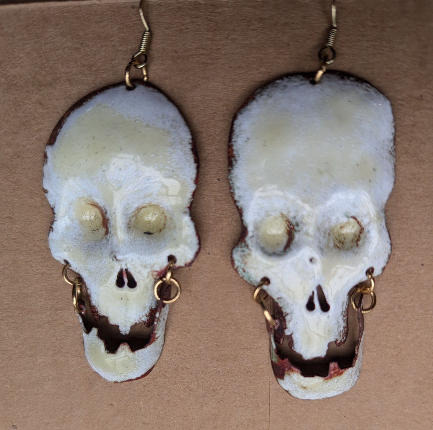 Big skull earrings: handmade, torch fired enamel, swinging jaws