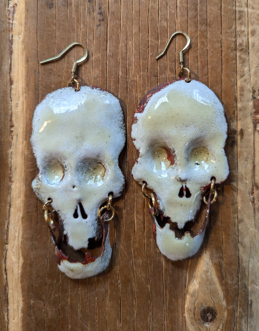 Big skull earrings: handmade, torch fired enamel, swinging jaws