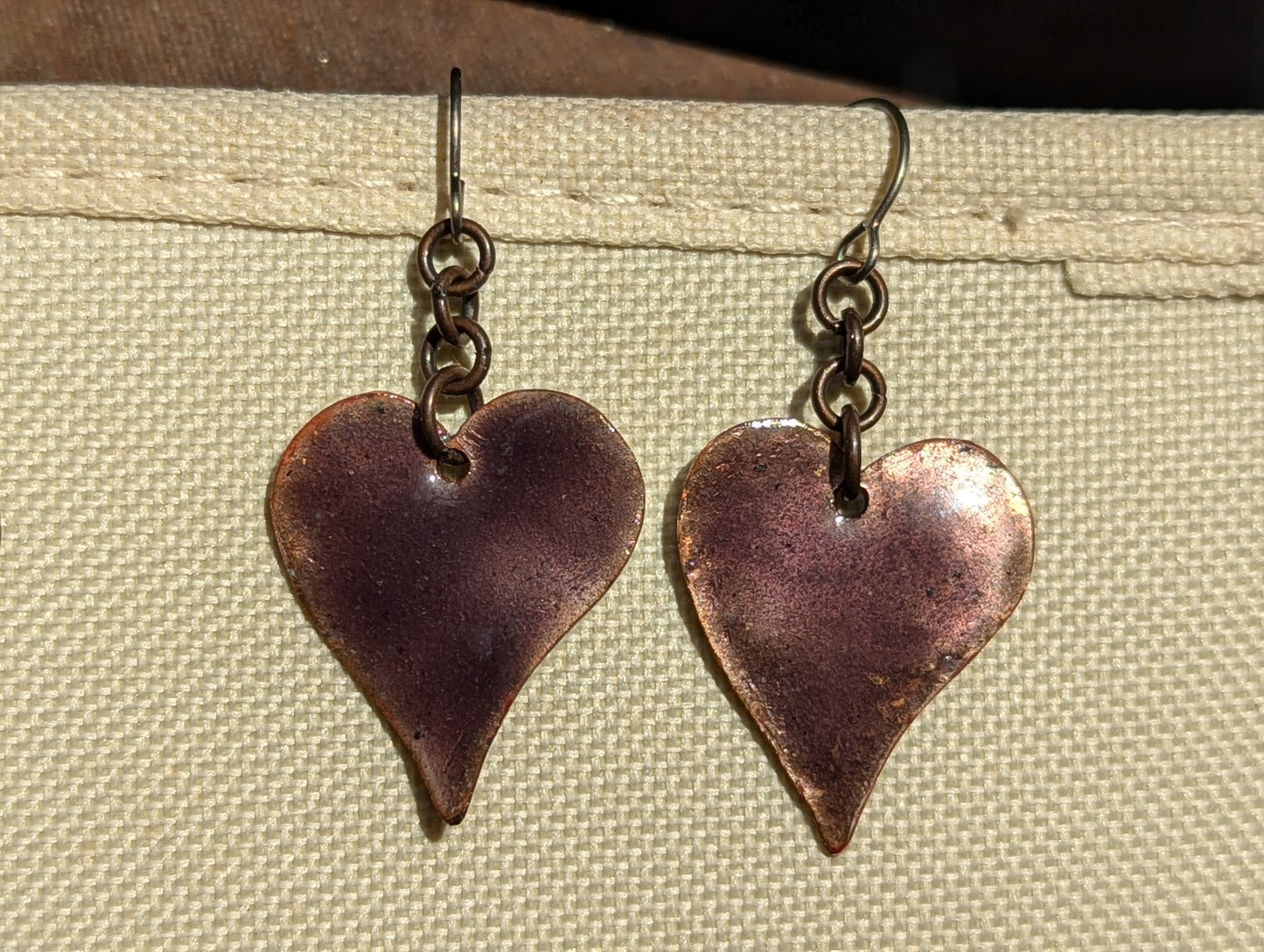 Purple heart earrings, copper torch fired translucent enamel