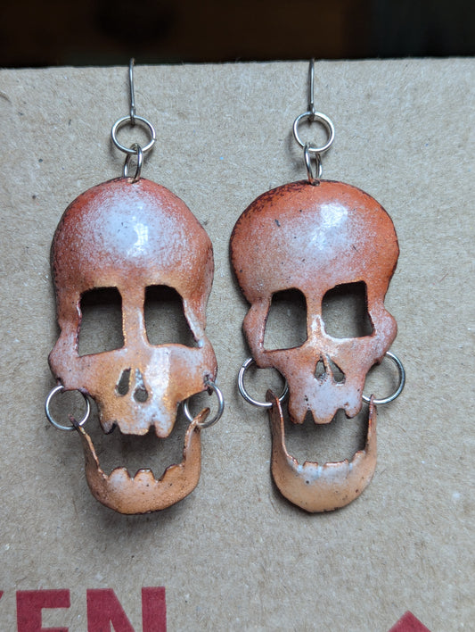 Skully earrings in translucent enamel letting the brushed copper shine through.