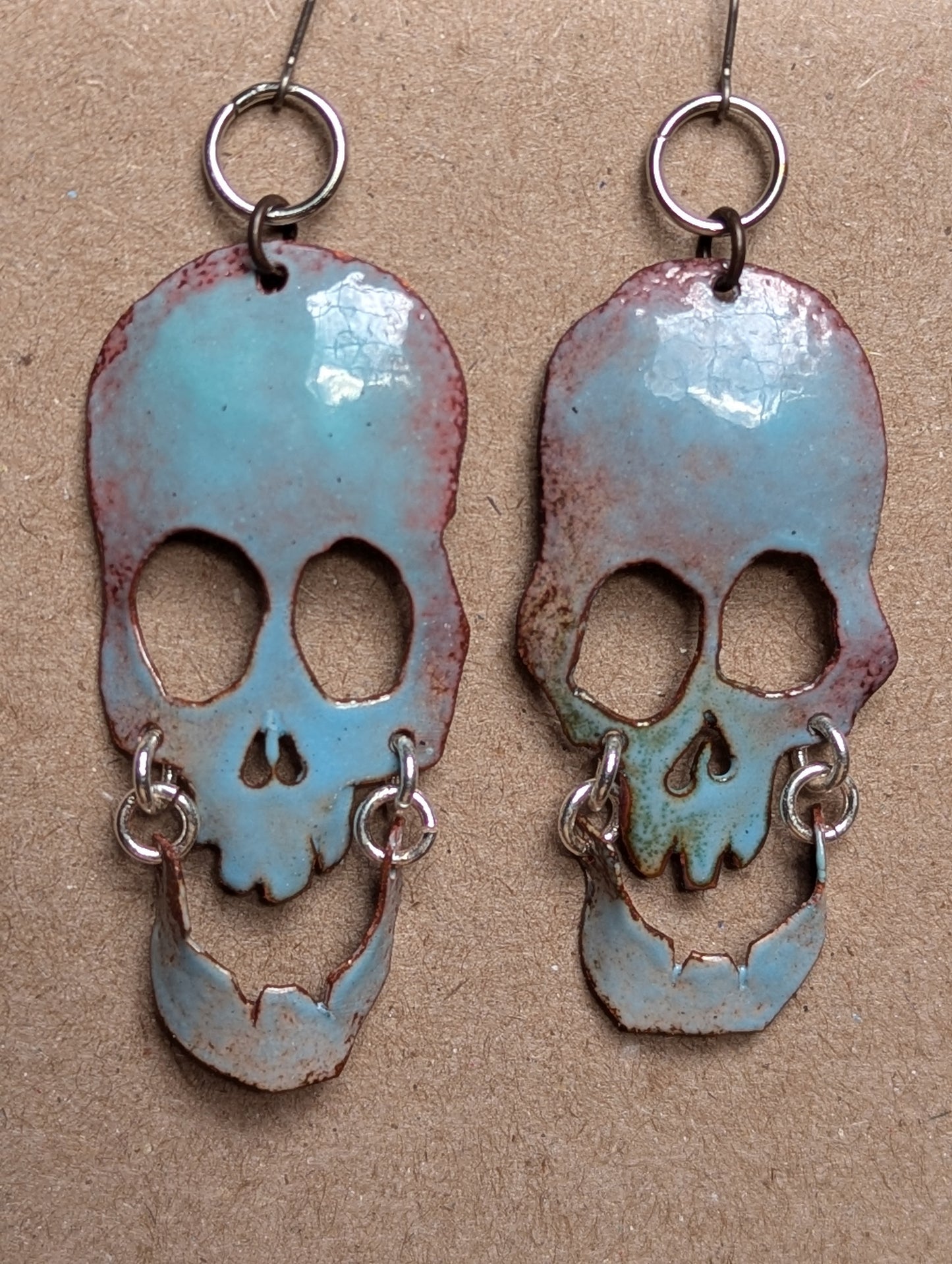 Halo Skully, enameled copper statement earrings with swinging jaws