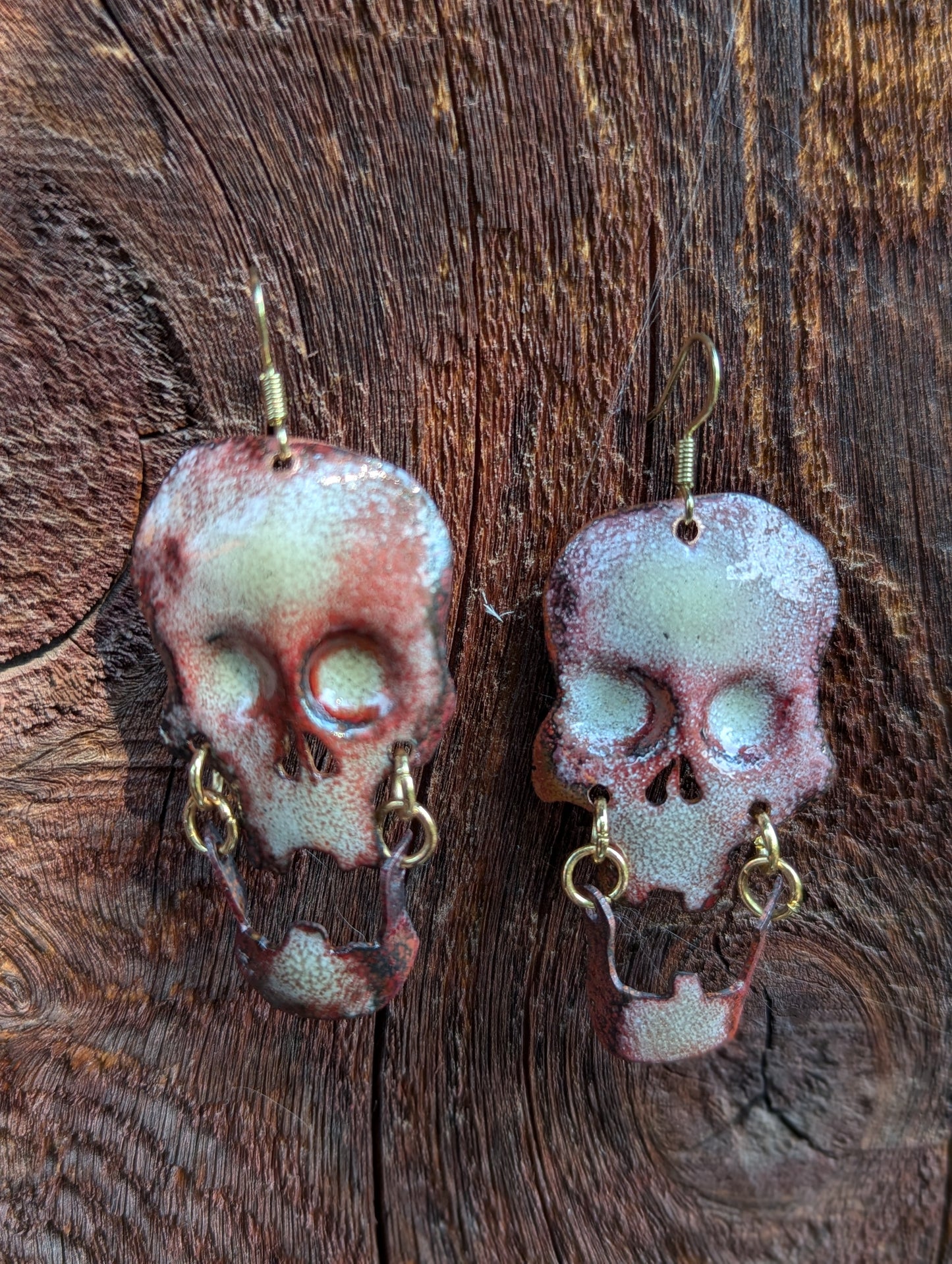 Skull earrings: handmade, torch fired enamel, swinging jaws